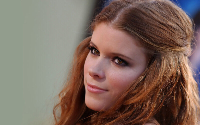 woman with red hair looking away