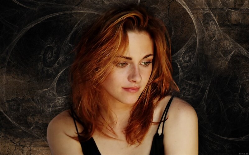woman with red hair looking down