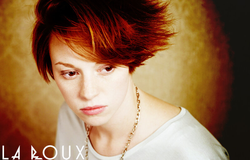 woman with red hair looking down