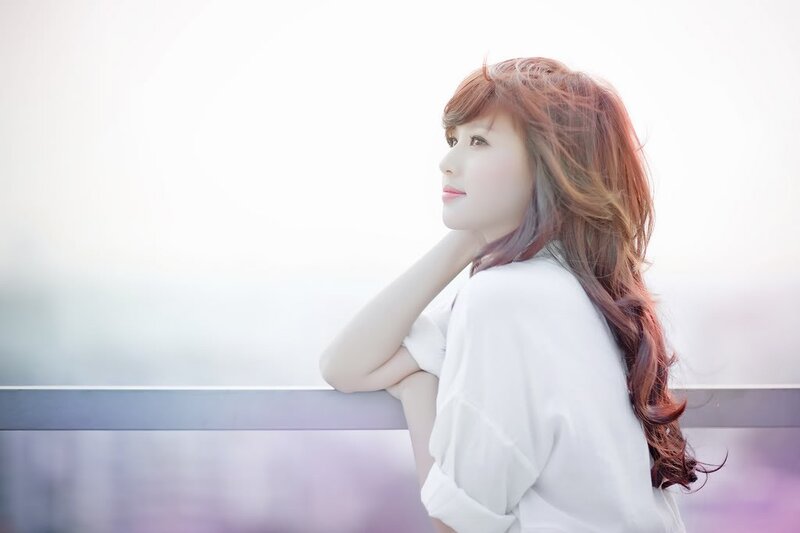woman with red hair looking out