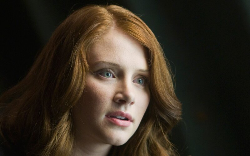 woman with red hair looking