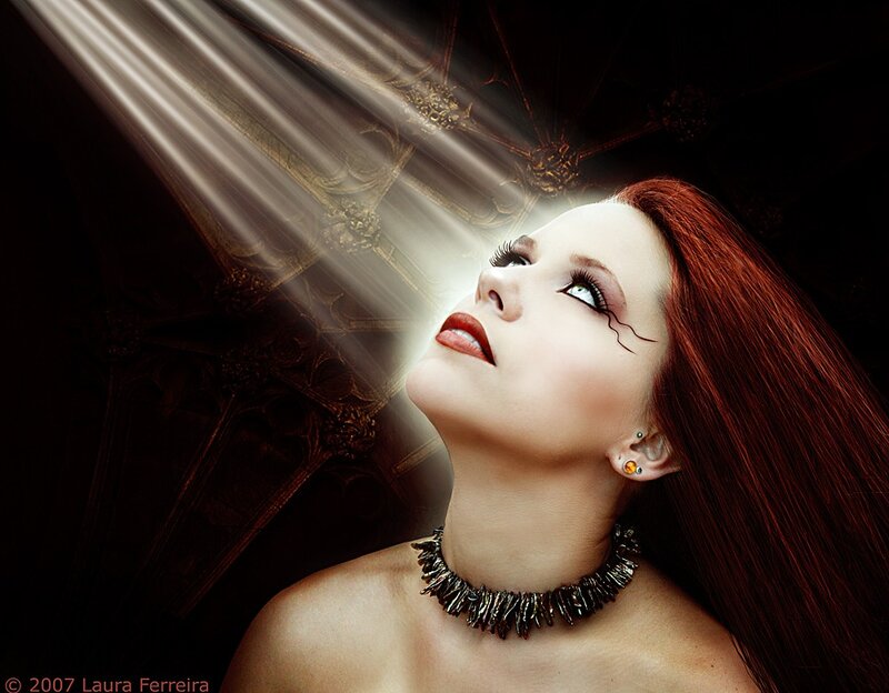 woman with red hair looking up