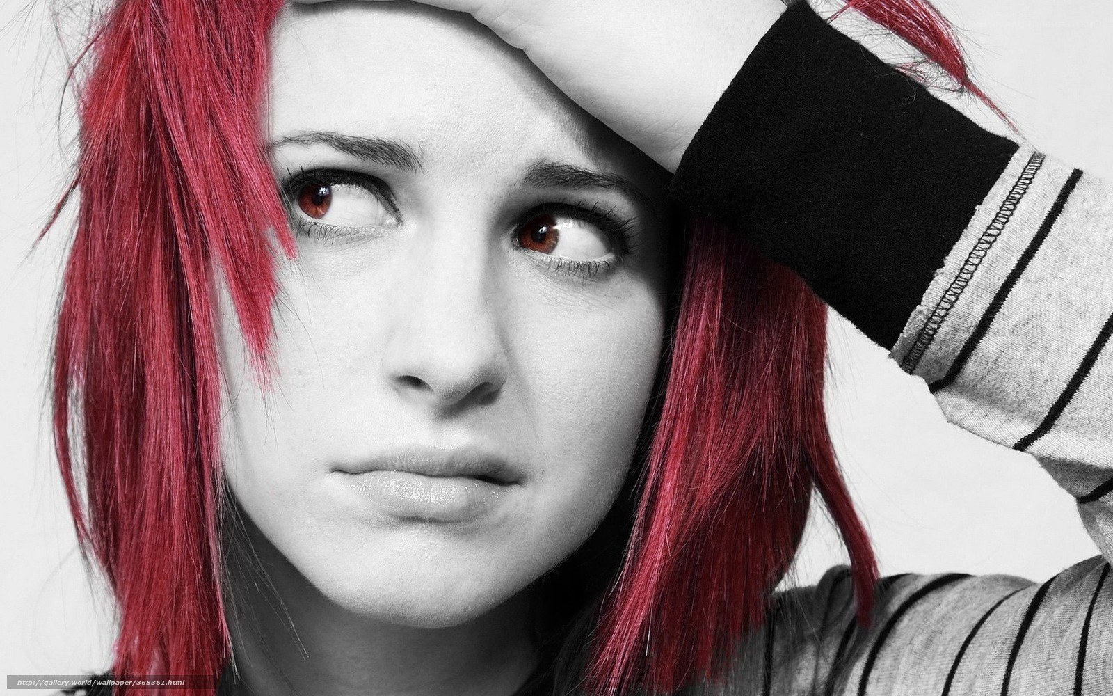 woman with red hair looking up