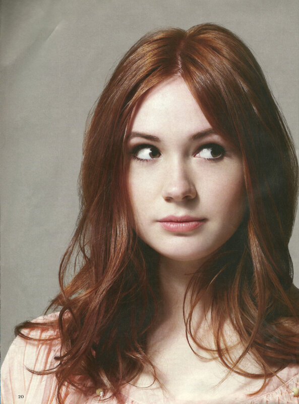 woman with red hair looking up