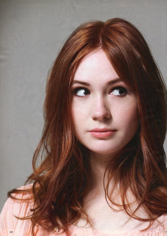 woman with red hair looking up