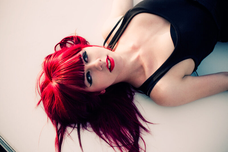 woman with red hair lying down