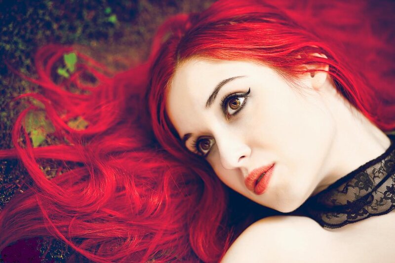woman with red hair lying down