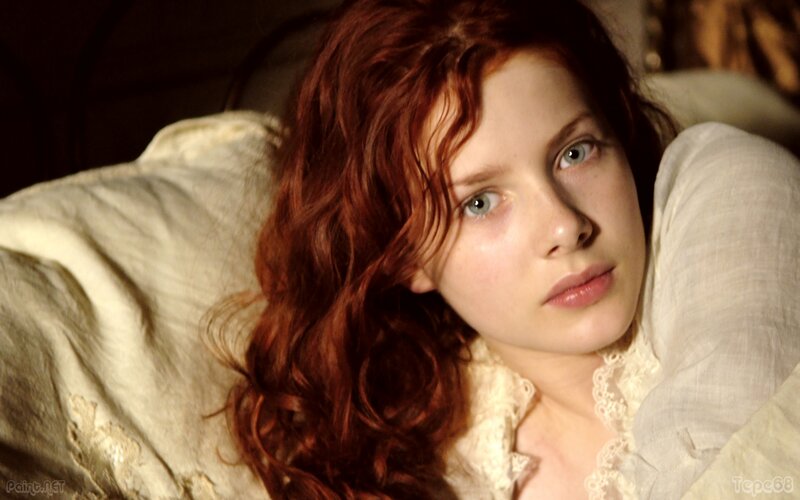 woman with red hair lying down