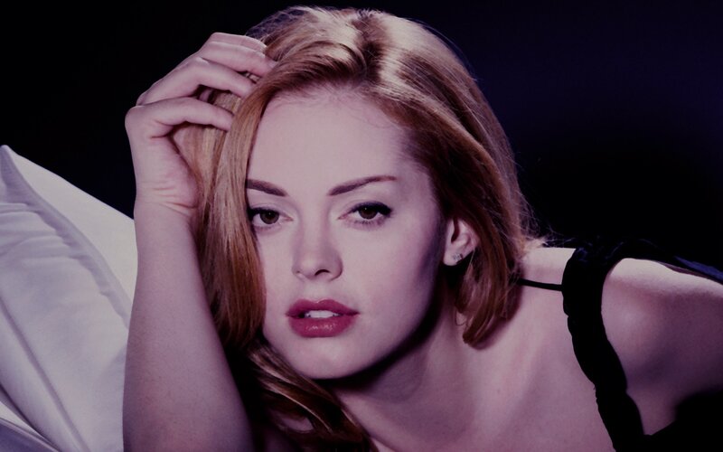 woman with red hair lying down