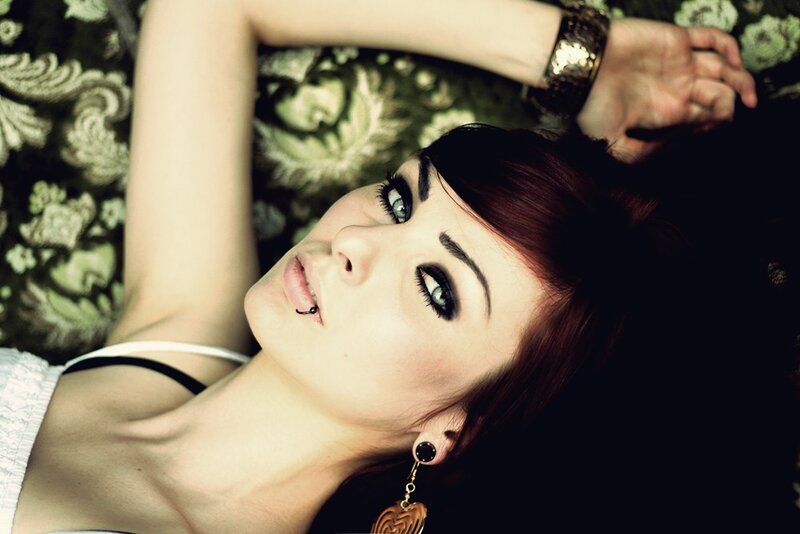 woman with red hair lying down