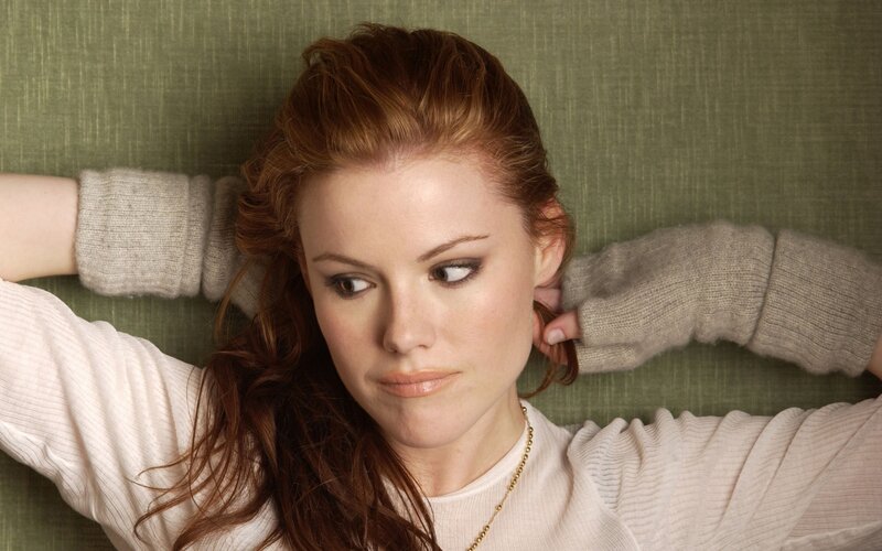 woman with red hair lying down