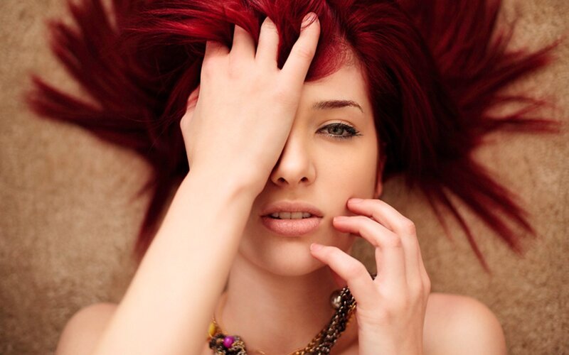 woman with red hair lying down