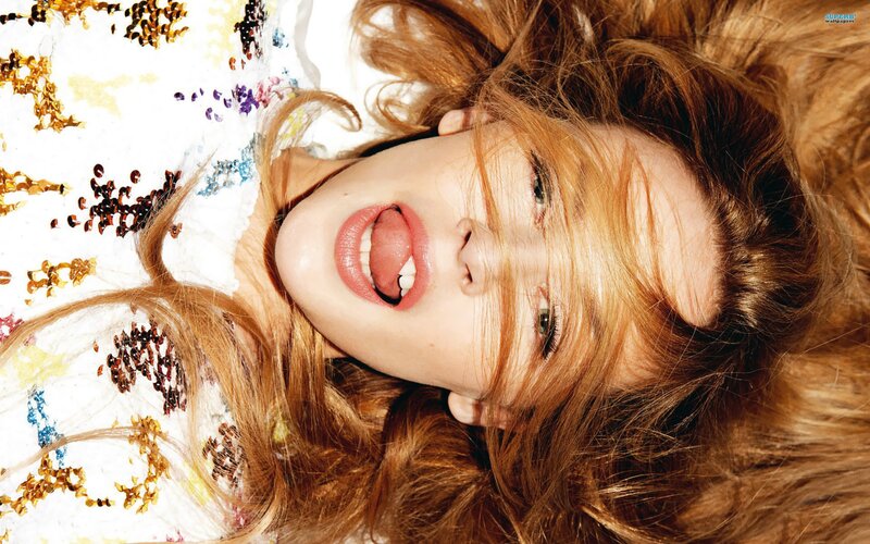 woman with red hair lying down