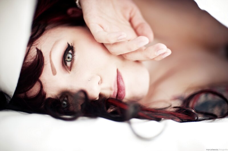 woman with red hair lying down