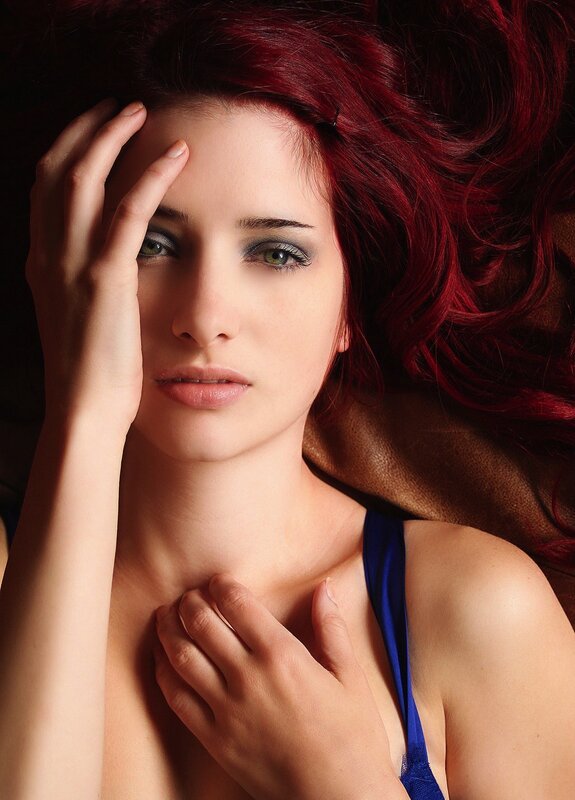woman with red hair lying down