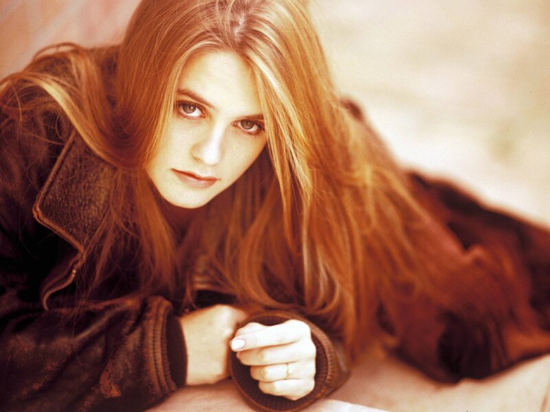 woman with red hair lying down