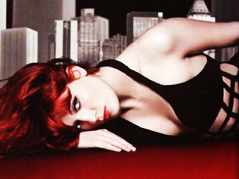 woman with red hair lying down