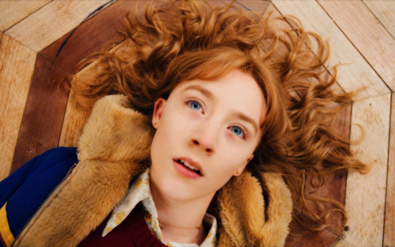 woman with red hair lying on floor