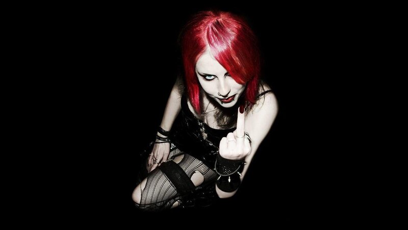 woman with red hair making a gesture