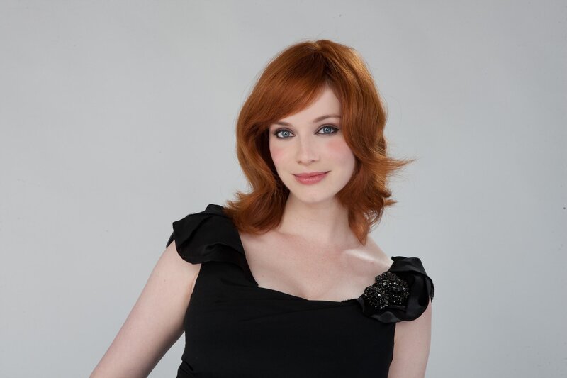 Woman with Red Hair — Neutral, Photograph, Black Dress, Blue Eyes, Studio Background