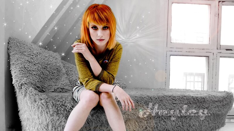 Woman with red hair on a couch