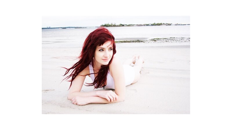 woman with red hair on beach