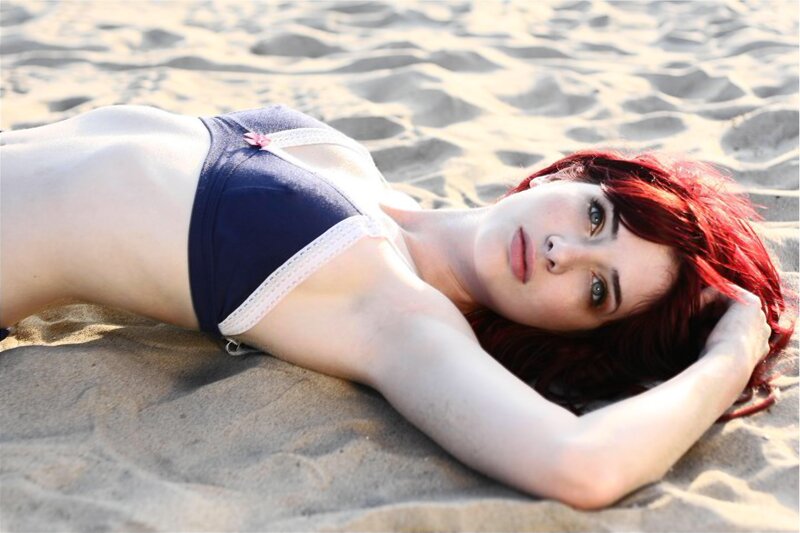 woman with red hair on beach