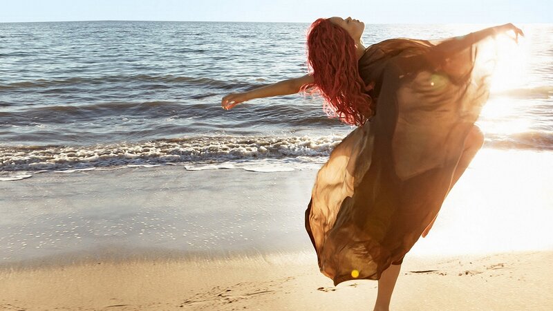 Woman with Red Hair on Beach — Brown, Serene