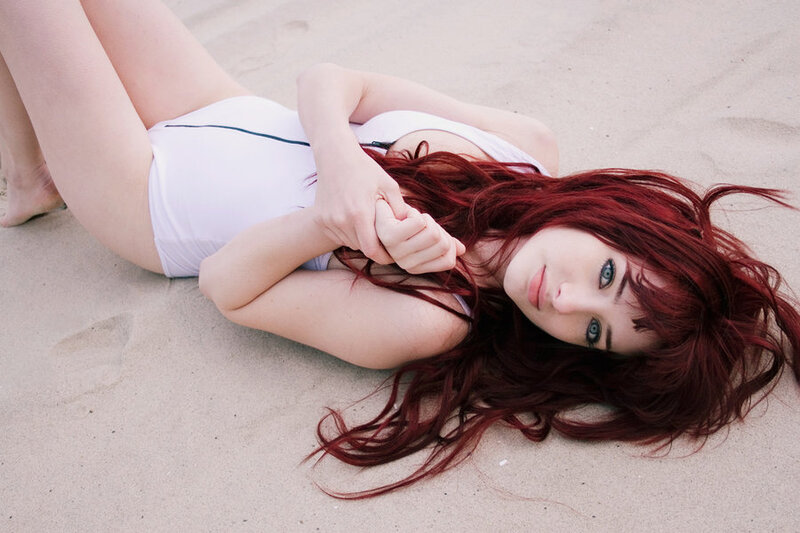 Woman with red hair on beach