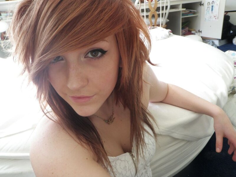 woman with red hair on bed