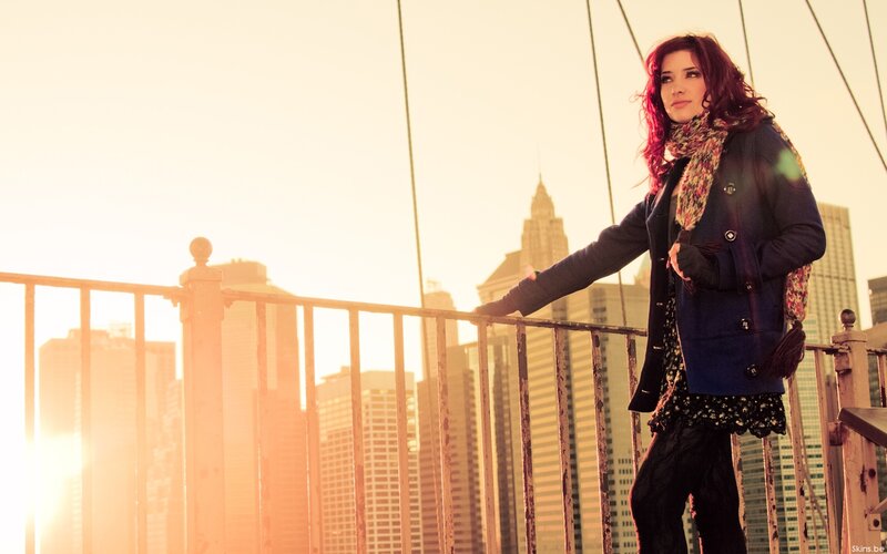Woman with Red Hair on Bridge