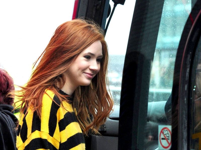 woman with red hair on bus