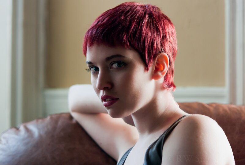 woman with red hair on couch