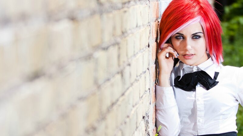 woman with red hair on phone