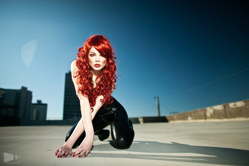 woman with red hair on rooftop