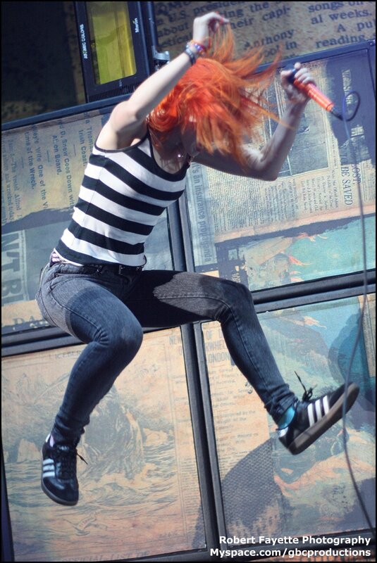 Woman with Red Hair on Stage — Energetic, Photograph, Microphone