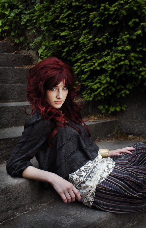 woman with red hair on steps