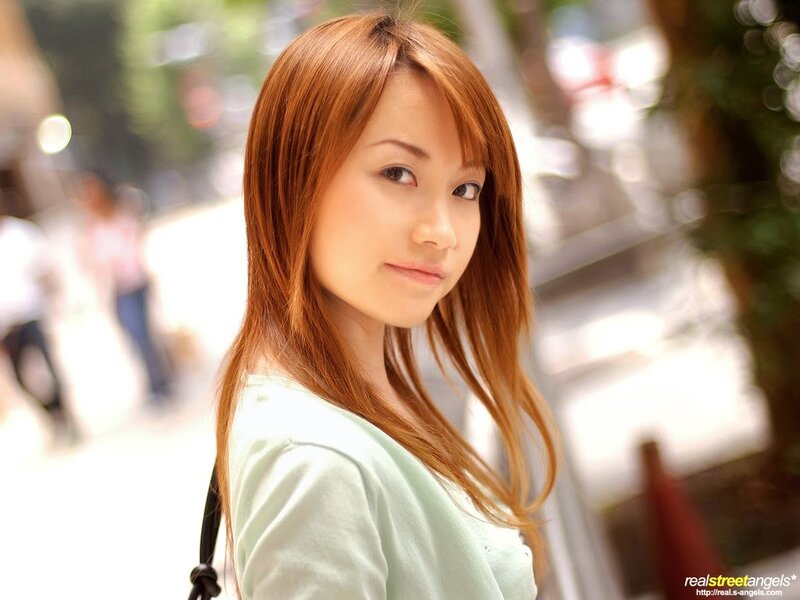 woman with red hair on street