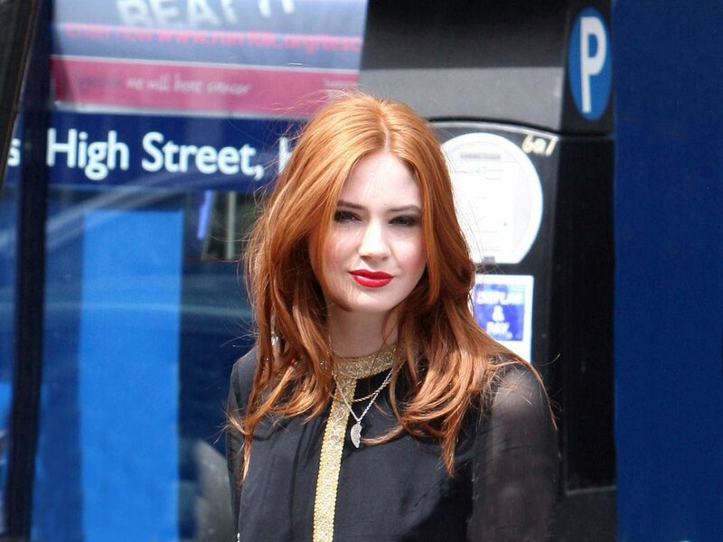 Woman with red hair on street