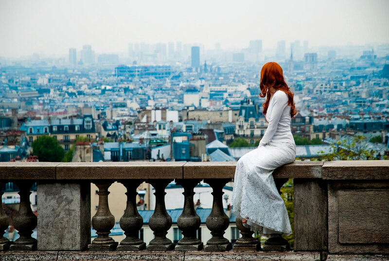Woman with red hair overlooking city