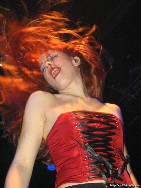 woman with red hair performing