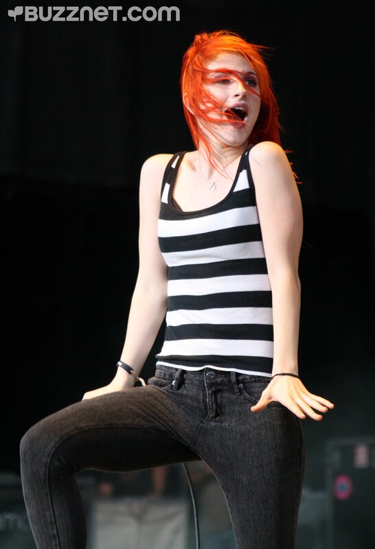 woman with red hair performing