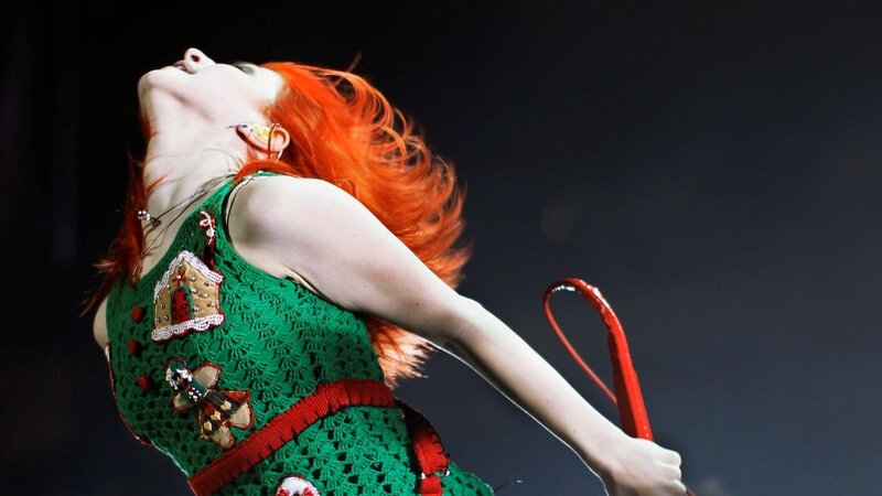 woman with red hair performing