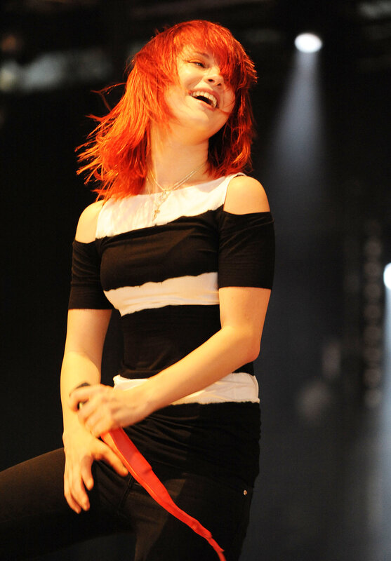 woman with red hair performing