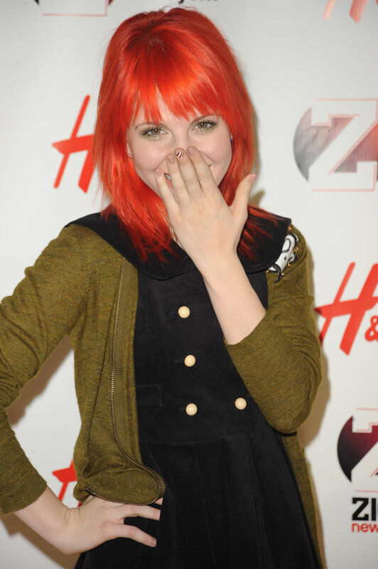 Woman with Red Hair — Playful, Photograph, Red Hair, Green Jacket