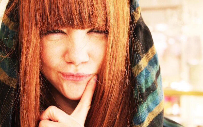 woman with red hair posing