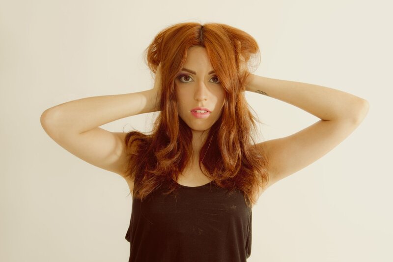 woman with red hair posing