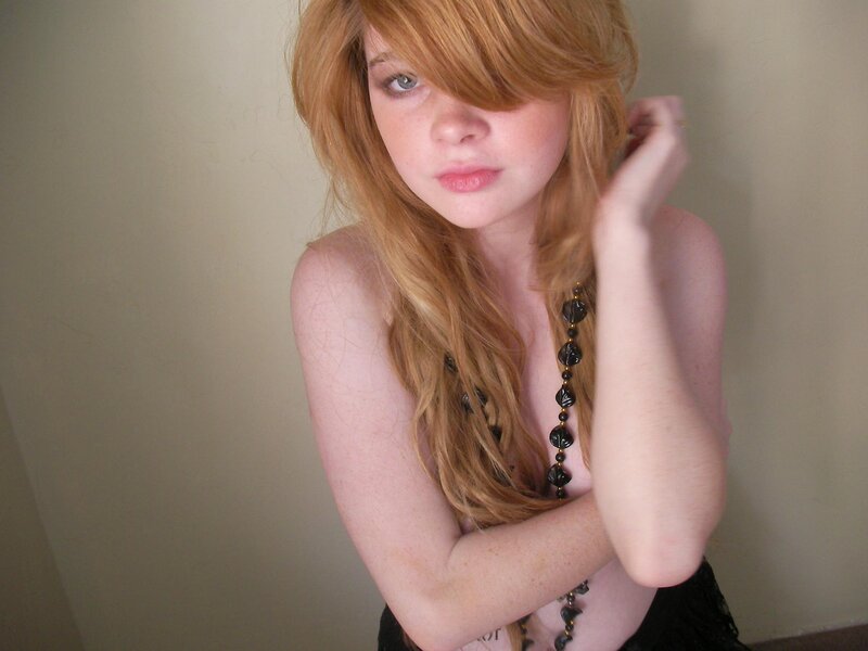 woman with red hair posing