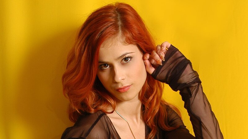 woman with red hair posing