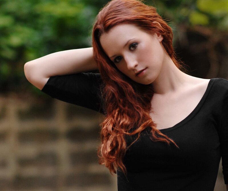 woman with red hair posing